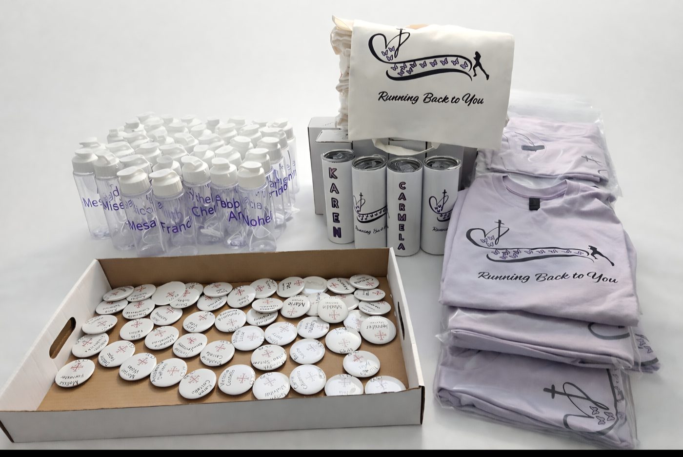 Full charity merchandise package donated to a family — personalized bottles, tumblers, and shirts, Roxbury Gives